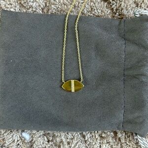 Uncommon James football shaped gold necklace